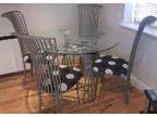 Dining Table & 4 Chairs Round glass dining table with....